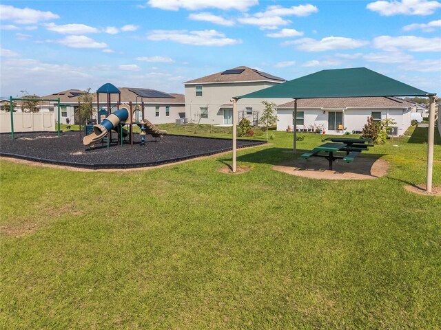 community play area with a lawn