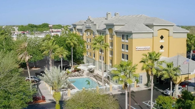 view of property featuring a community pool