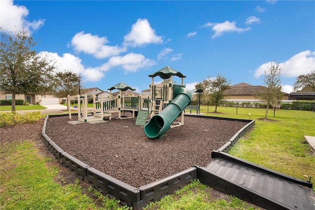 community play area featuring a lawn