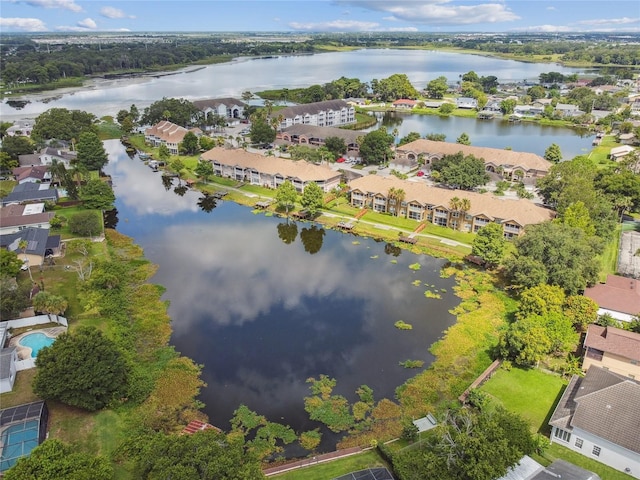 birds eye view of property featuring a water view and a residential view