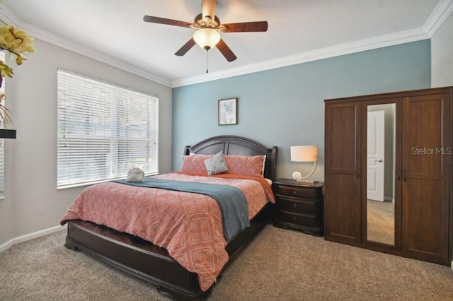 carpeted bedroom with ceiling fan, crown molding, and baseboards