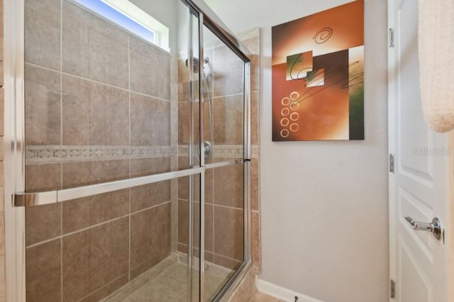 bathroom featuring a shower stall