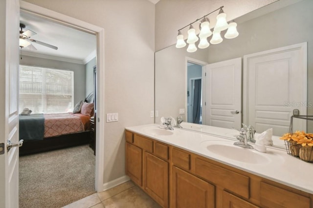 ensuite bathroom with a sink, ensuite bath, tile patterned floors, and crown molding