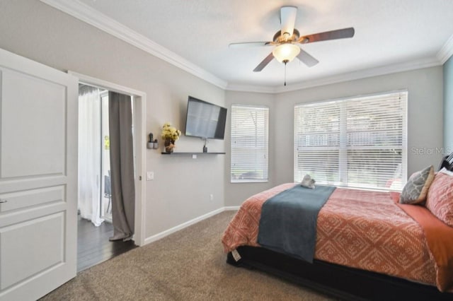 carpeted bedroom with crown molding, a ceiling fan, and baseboards