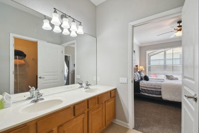 ensuite bathroom featuring a sink, double vanity, and connected bathroom