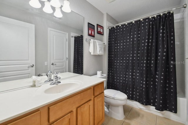 bathroom with tile patterned flooring, toilet, and vanity