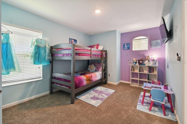 bedroom with baseboards and carpet floors