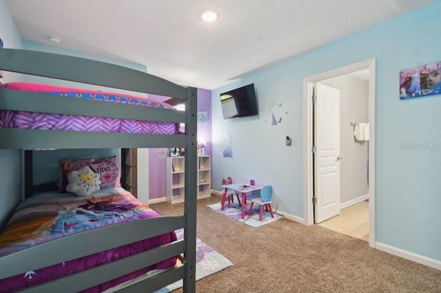 bedroom with baseboards and carpet