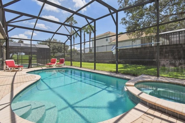 view of swimming pool featuring a patio area, glass enclosure, and fence