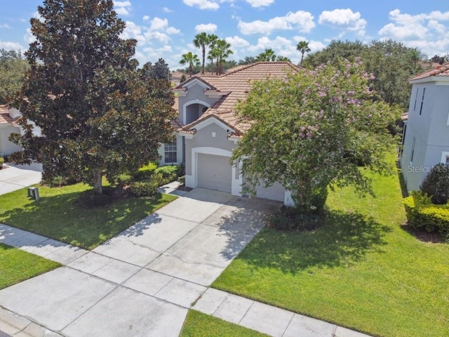 view of front of home featuring stucco siding, concrete driveway, a tile roof, and a front yard