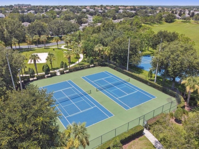 view of tennis court featuring fence