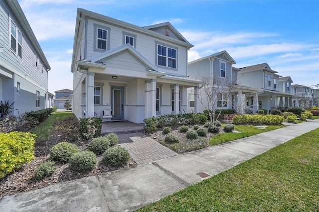 view of front of property with a porch and a residential view