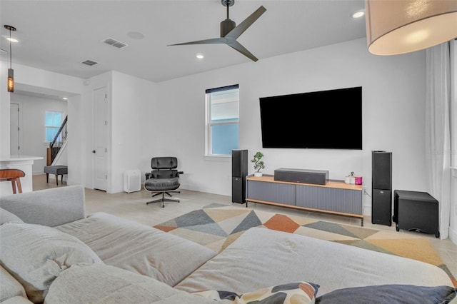 living area with visible vents, recessed lighting, stairway, and a ceiling fan