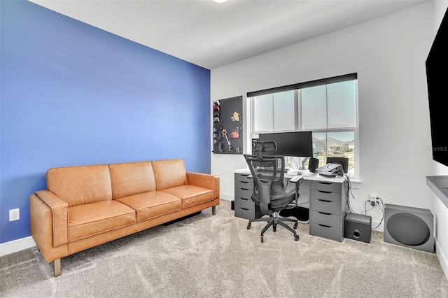 office with baseboards and carpet floors