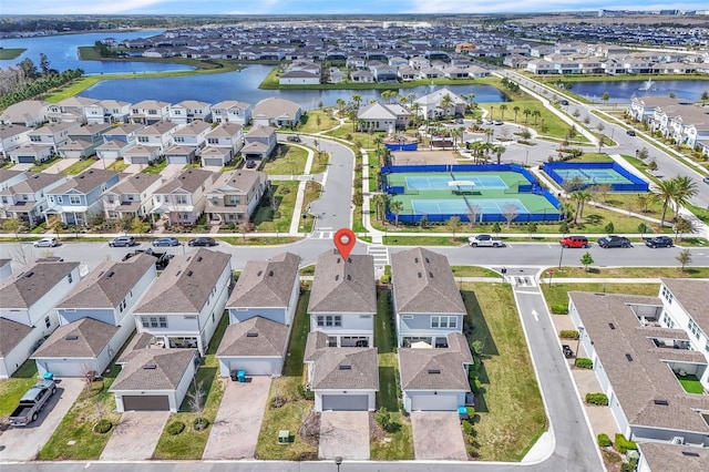 bird's eye view featuring a residential view and a water view