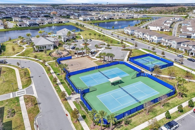 aerial view with a residential view and a water view