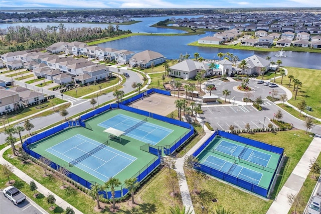 bird's eye view with a residential view and a water view