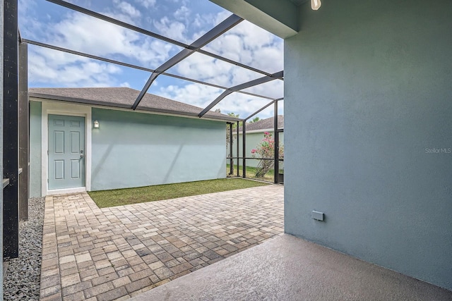 view of patio / terrace with glass enclosure