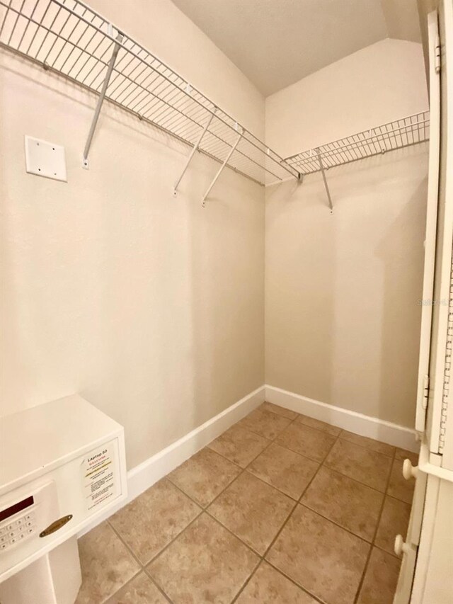 spacious closet with tile patterned flooring