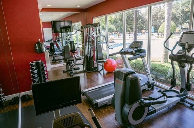 exercise room featuring recessed lighting and wood finished floors