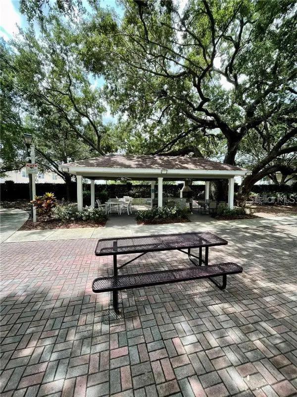 surrounding community with a gazebo and a patio area