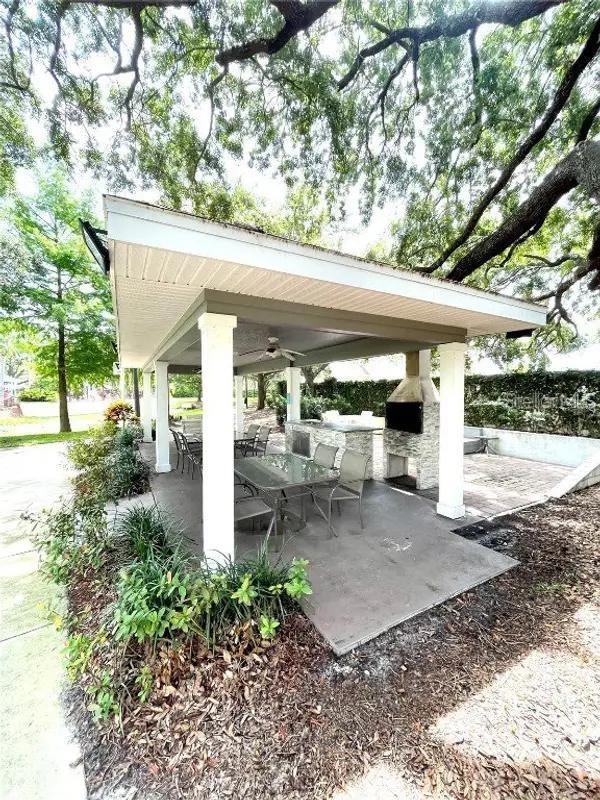 view of patio / terrace with outdoor dining area and a ceiling fan