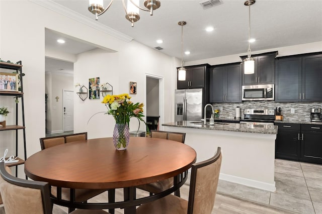 dining space featuring recessed lighting, visible vents, and crown molding