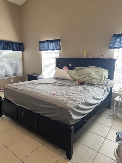 bedroom with light tile patterned floors