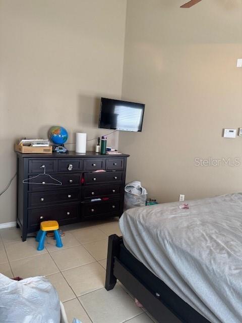 bedroom featuring light tile patterned floors