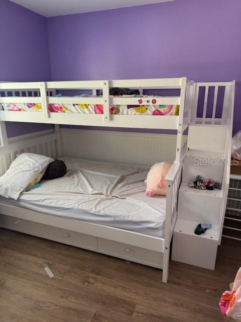 bedroom featuring wood finished floors