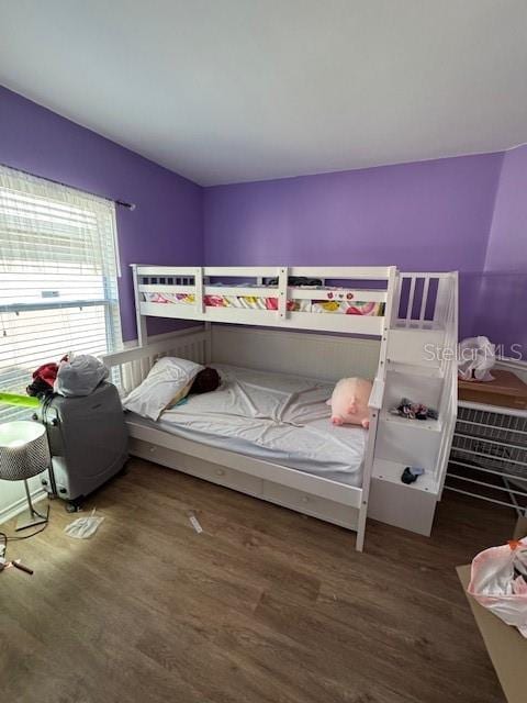 bedroom featuring wood finished floors