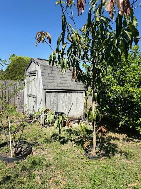 view of shed with fence