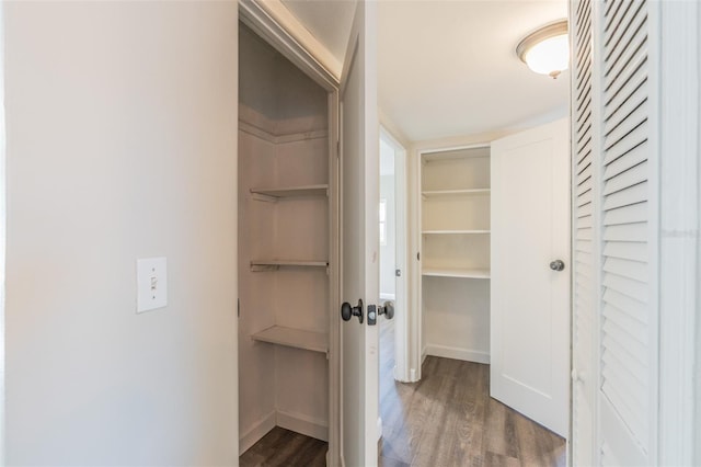 interior space with wood finished floors and baseboards