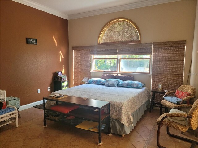 bedroom featuring light tile patterned flooring, baseboards, and ornamental molding