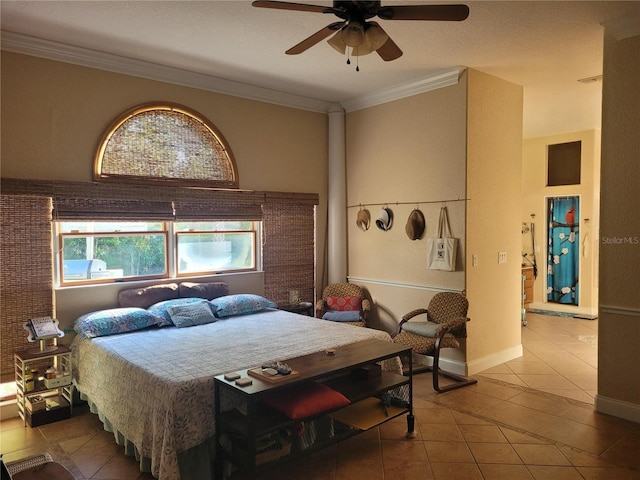 tiled bedroom with crown molding, a ceiling fan, and baseboards