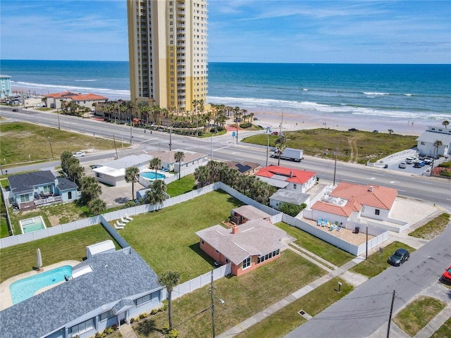 birds eye view of property featuring a view of the beach and a water view