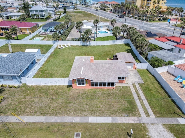 birds eye view of property with a residential view