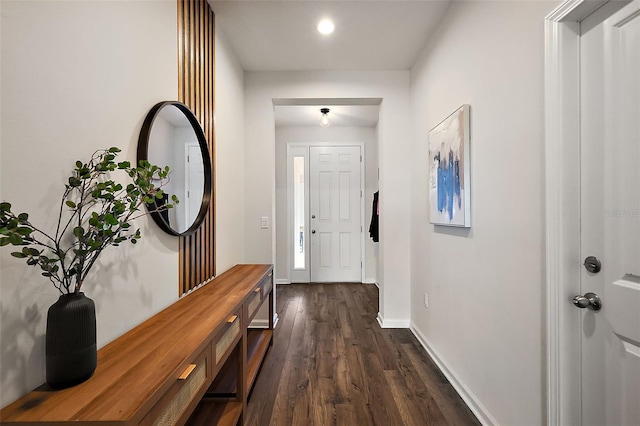 interior space with recessed lighting, baseboards, and dark wood-style flooring