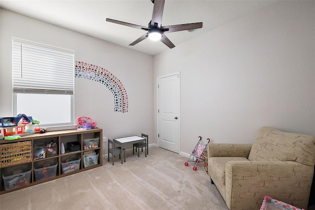 rec room featuring carpet, baseboards, and ceiling fan