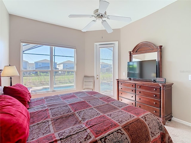 carpeted bedroom with baseboards, a ceiling fan, and access to outside