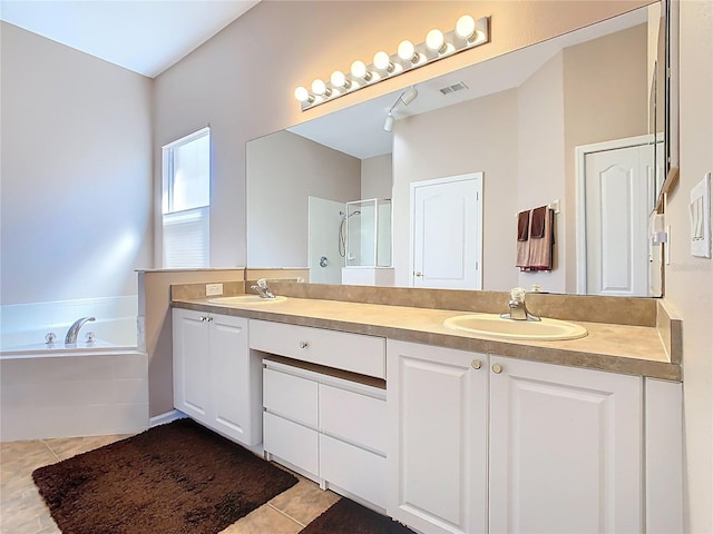 full bath with a garden tub, a stall shower, visible vents, and a sink