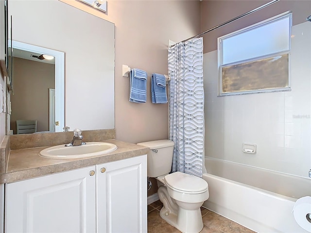 bathroom with tile patterned floors, shower / bath combination with curtain, toilet, and vanity