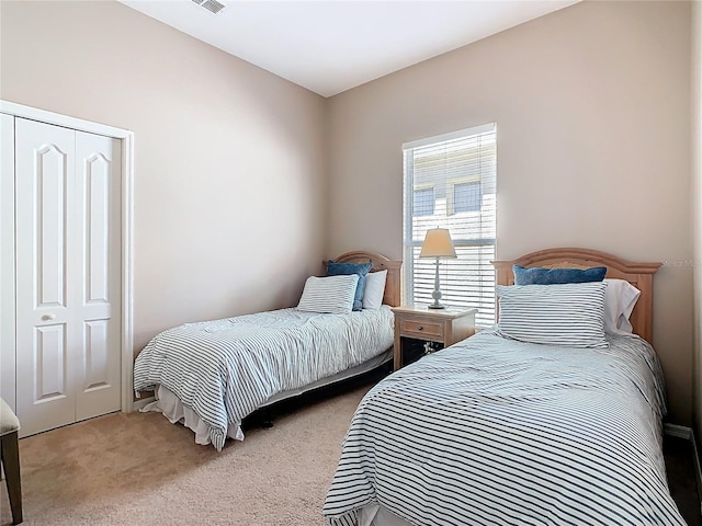 bedroom featuring light colored carpet