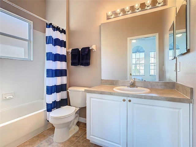 full bathroom featuring tile patterned flooring, shower / bath combo with shower curtain, toilet, and vanity