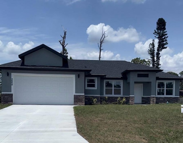 view of front of property with stone siding, concrete driveway, and stucco siding