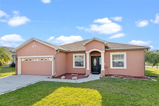 single story home with an attached garage, a shingled roof, stucco siding, a front lawn, and concrete driveway