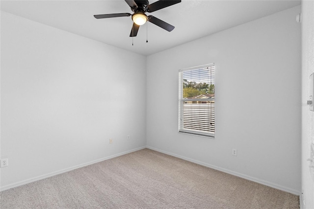 unfurnished room with ceiling fan, baseboards, and carpet floors