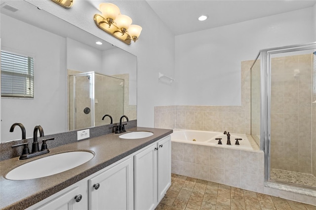 bathroom featuring a sink, visible vents, a stall shower, and a bath