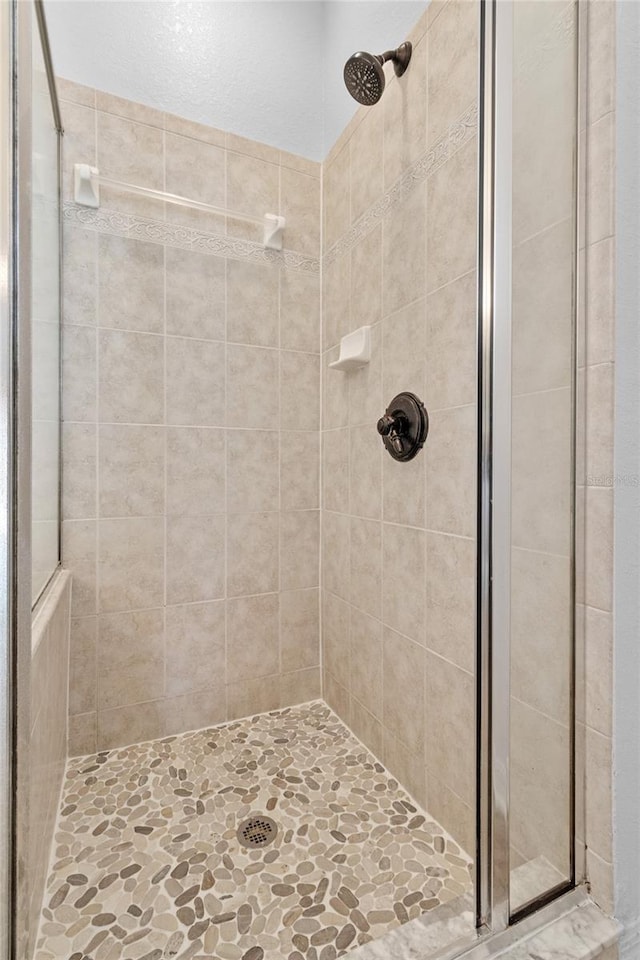 bathroom featuring a stall shower