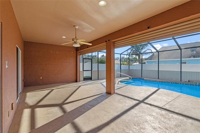 exterior space with a swimming pool and ceiling fan